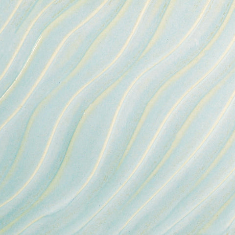 Glossy pale blue Cloud glaze, breaking on texture with peachy float, perfect for layering. Amaranth Stoneware Canada.