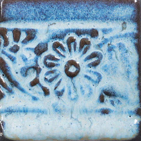 Glossy pale blue Cloud glaze, breaking on texture with peachy float, perfect for layering. Amaranth Stoneware Canada.