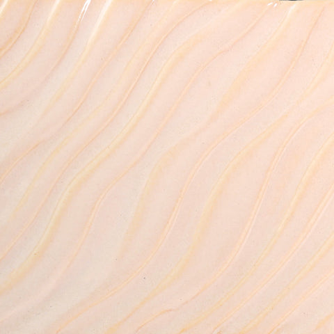 Glossy pale pink Flower glaze, breaking on texture with peachy float, perfect for layering. Amaranth Stoneware Canada.