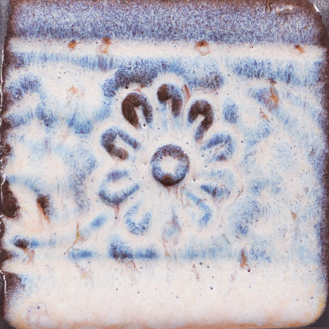 Glossy pale pink Flower glaze, breaking on texture with peachy float, perfect for layering. Amaranth Stoneware Canada.