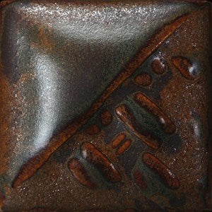 Rusted Iron semi-matte, opaque glaze with metallic orange and brown at Cone 6; thicker application gives metallic matte, thinner results in smoother, darker color.
At Cone 10: Increased orange/copper mottling and movement. Amaranth Stoneware Canada.