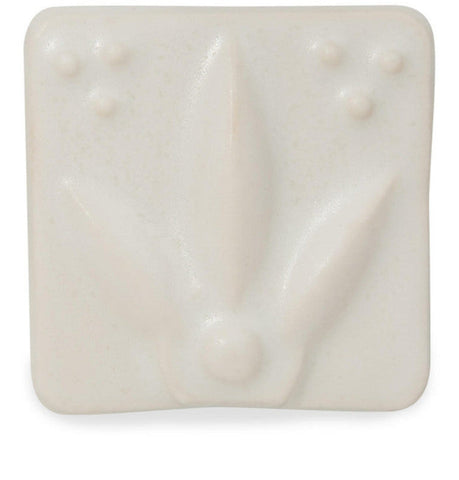 Satin Matte White glaze, smooth and buttery, enhances textured ware with a classic art deco style. Amaranth Stoneware Canada.