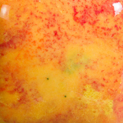 Sassy Orange opaque yellow/orange base glaze with red, green, orange, and yellow crystals at Cone 06; base glaze remains as crystals fade and melt.
At Cone 6: Enhanced mobility, surface issues may occur. Amaranth Stoneware Canada.