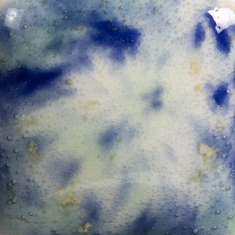 Seawind is an opaque white glaze with green, yellow, and blue crystals at Cone 06.
At Cone 6: Base glaze and crystals fade and melt with enhanced mobility. Surface issues may occur. Amaranth Stoneware Canada.