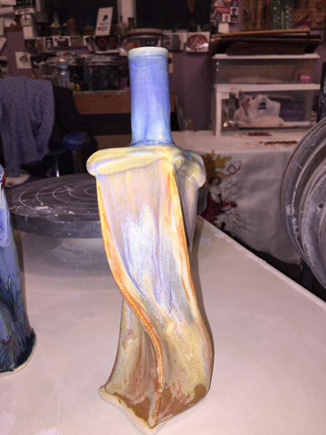 A variegated glaze with brown, orange, blue, and gold tones. Alternative to Red Gold. Amaranth Stoneware Canada.