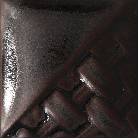Cone 6: Wrought Iron creates a dappled black gloss-matte finish, resembling high fire oil-spot glazes with just two coats.
Cone 10: Color changes to a dark metallic gray. Amaranth Stoneware Canada.