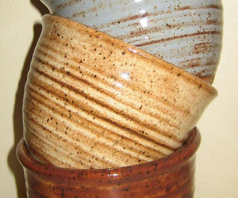 A lighter shino with orange-brown spots that breaks to brown over texture. Combines well with other glazes. Amaranth Stoneware Canada.
